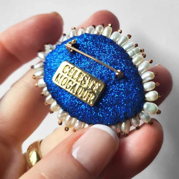 Broche oog blauw wit